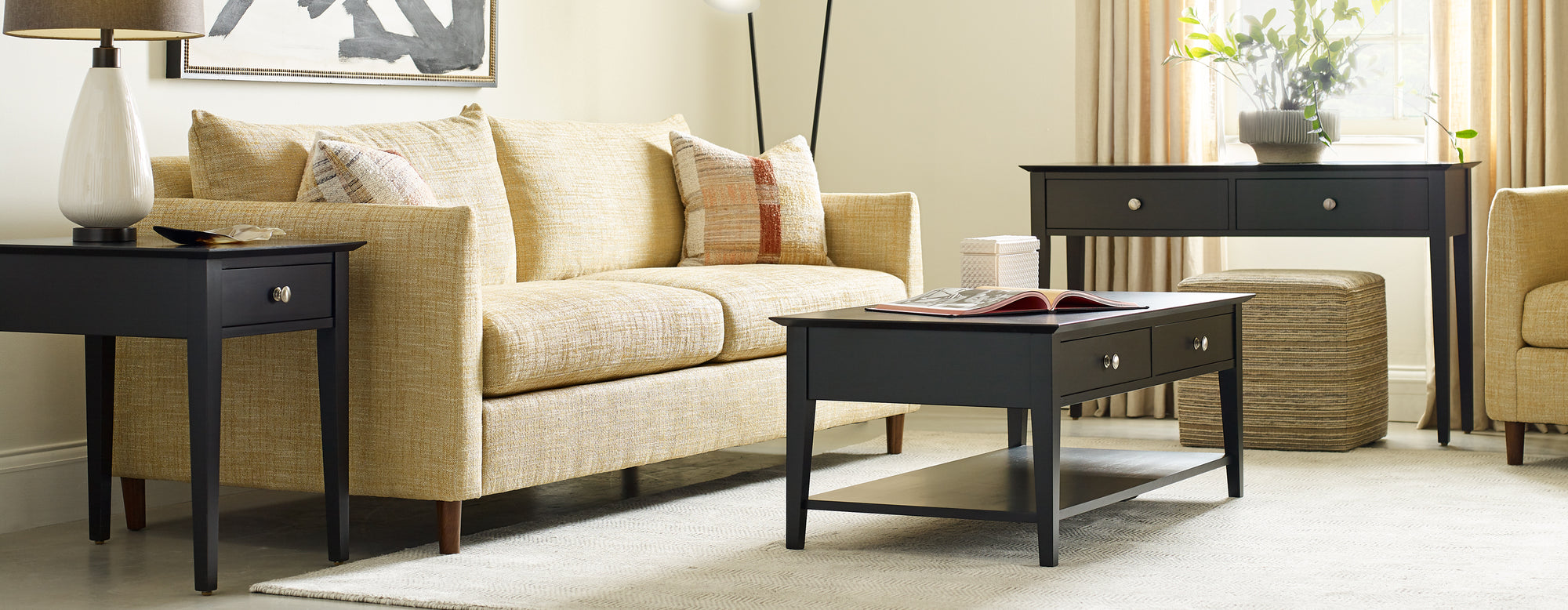 Lifestyle of a Gable Road Rectangular Coffee Table in the color 809-EBONY with a matching Console Table next to it in the background