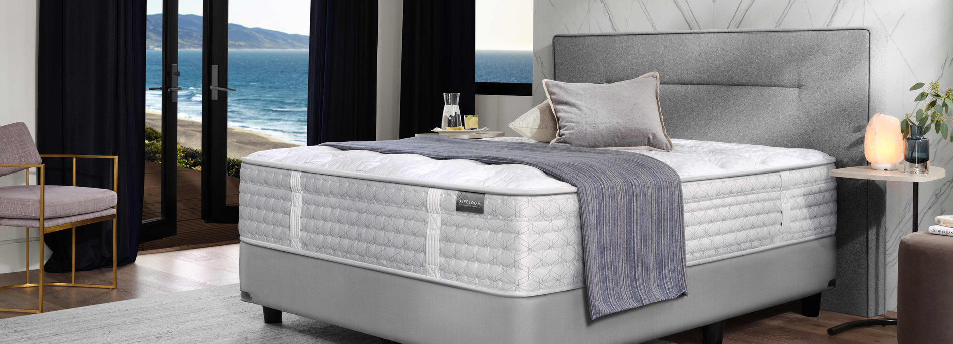 Aireloom Mattress on top of a gray upholstered bed frame
