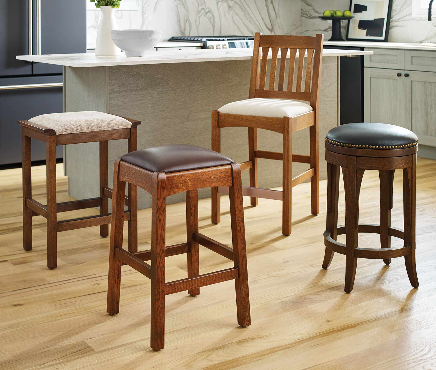Four assorted stools that can be used with Stickley Gathering Islands