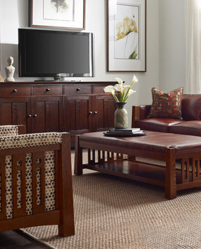 Stickley Furniture Highlands collection sofas with coffee table with a Highlands entertainment console in the background