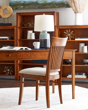 Origins by Stickley desk with upholstered side chair. Matching bookcases are in the background.