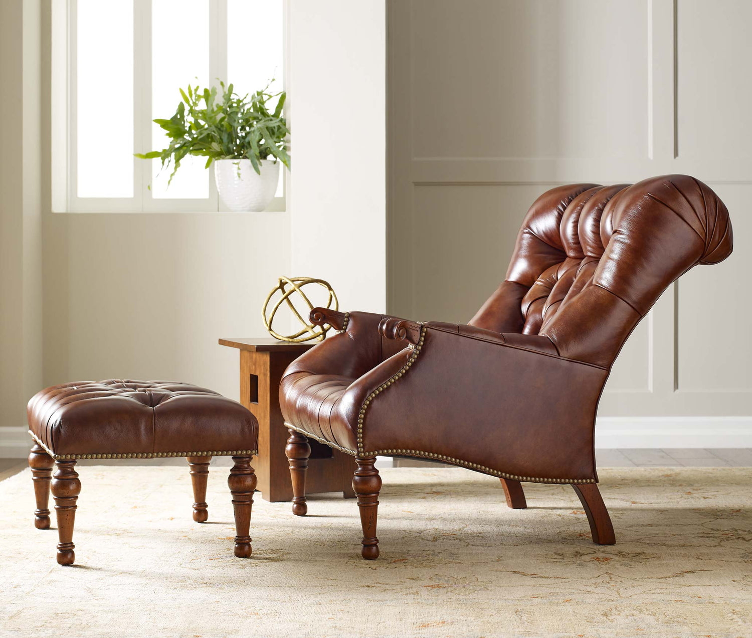 Lifestyle of a Leopold's Chair and Ottoman sitting in a room with white walls and natural sunlight from a  window in the corner