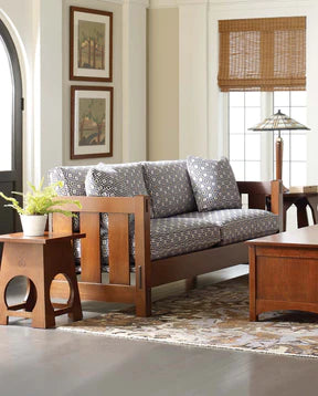 Stickley living room set up with a Settle sofa, an end table, and coffee table
