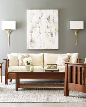 Stickley Park Slope collection living room set up with a white cream fabric covered sofa, coffee table, and accent chair