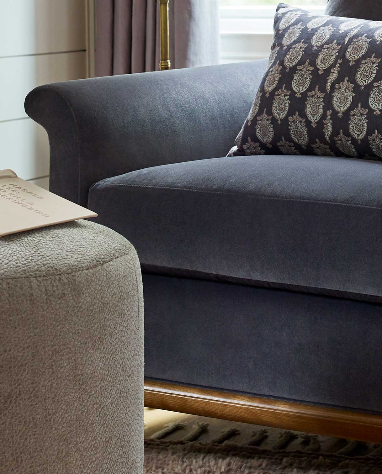 A closeup of a Martine Chair showing a dark blue fabric option