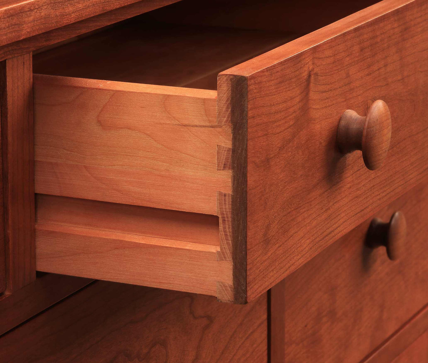 Close up displaying the side-hung and center-guided drawers that are used in all Mission furniture