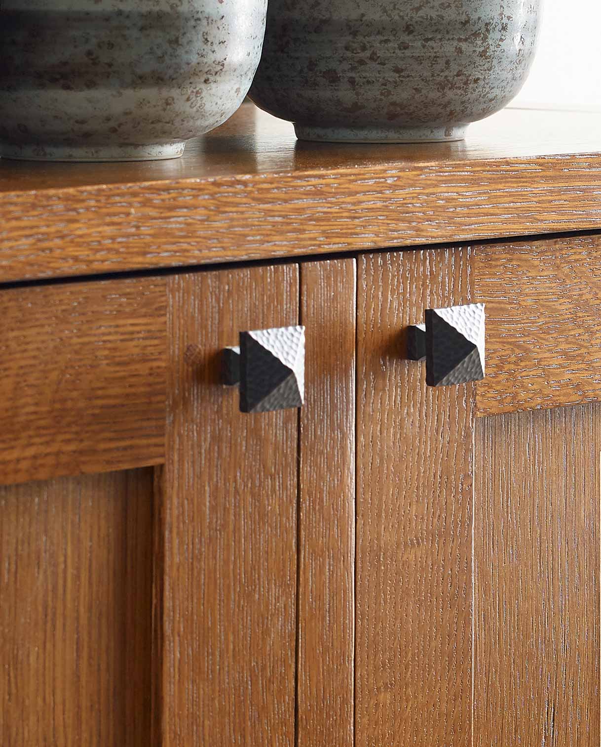 A closeup of hammered pyramidal knobs used on some Mission furniture pieces