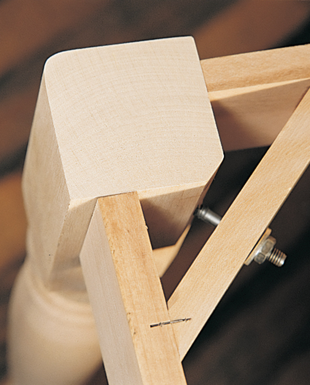 Close up of the corner bolt system used in the table legs of Nichols & Stone by Stickley products