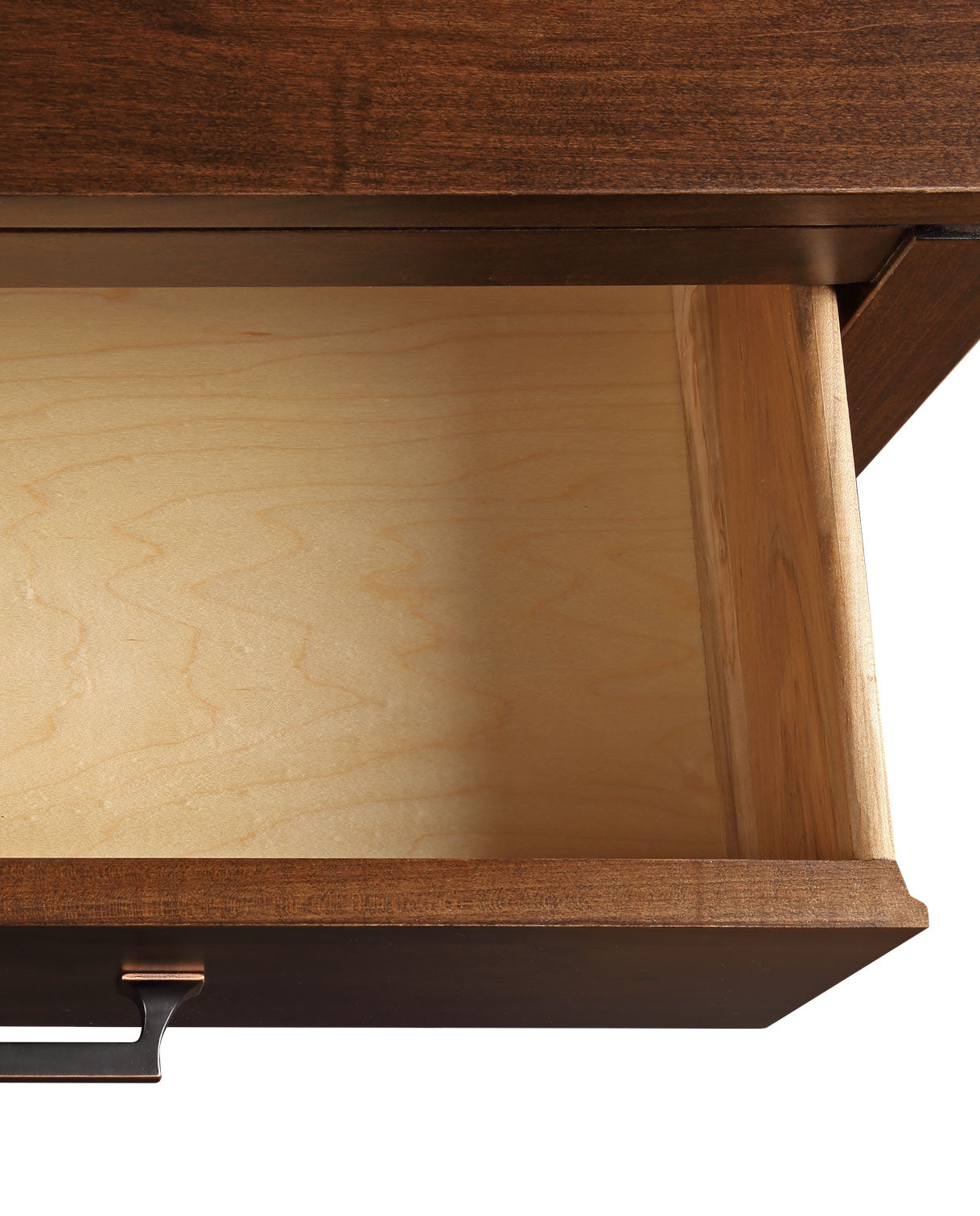 Close up of an open drawer showing maple wood grain